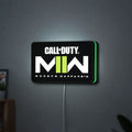 Call of Duty Modern Warfare II LED lightbox hanging on a wall with green glow
