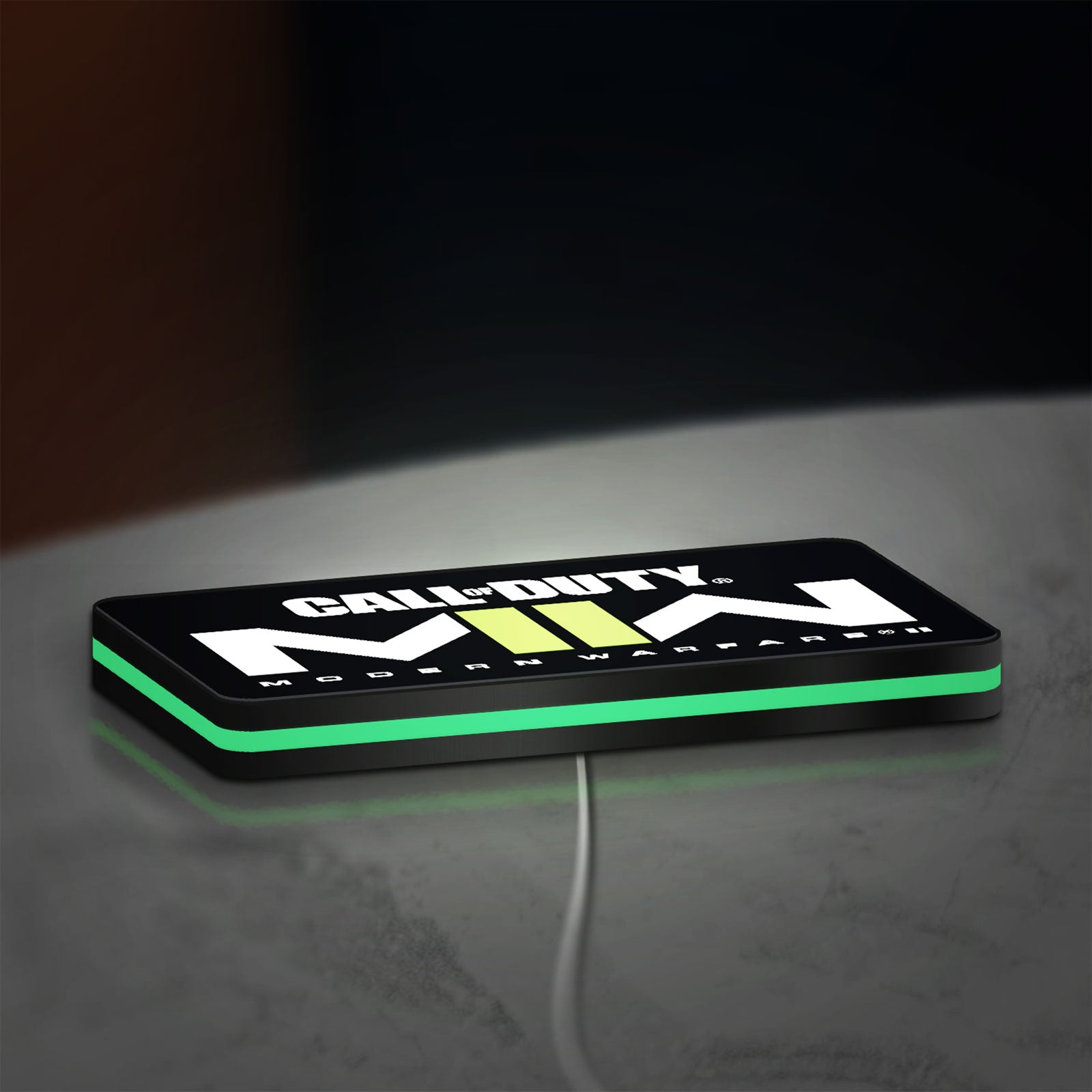 Call of Duty Modern Warfare II LED lightbox lying flat on a desk with green glow