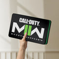 Unlit Call of Duty Modern Warfare II LED lightbox held by hand to show size and details