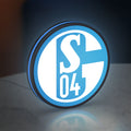 FC Gelsenkirchen Schalke 04 LED lightbox standing on a desk from an angled side view with blue glow