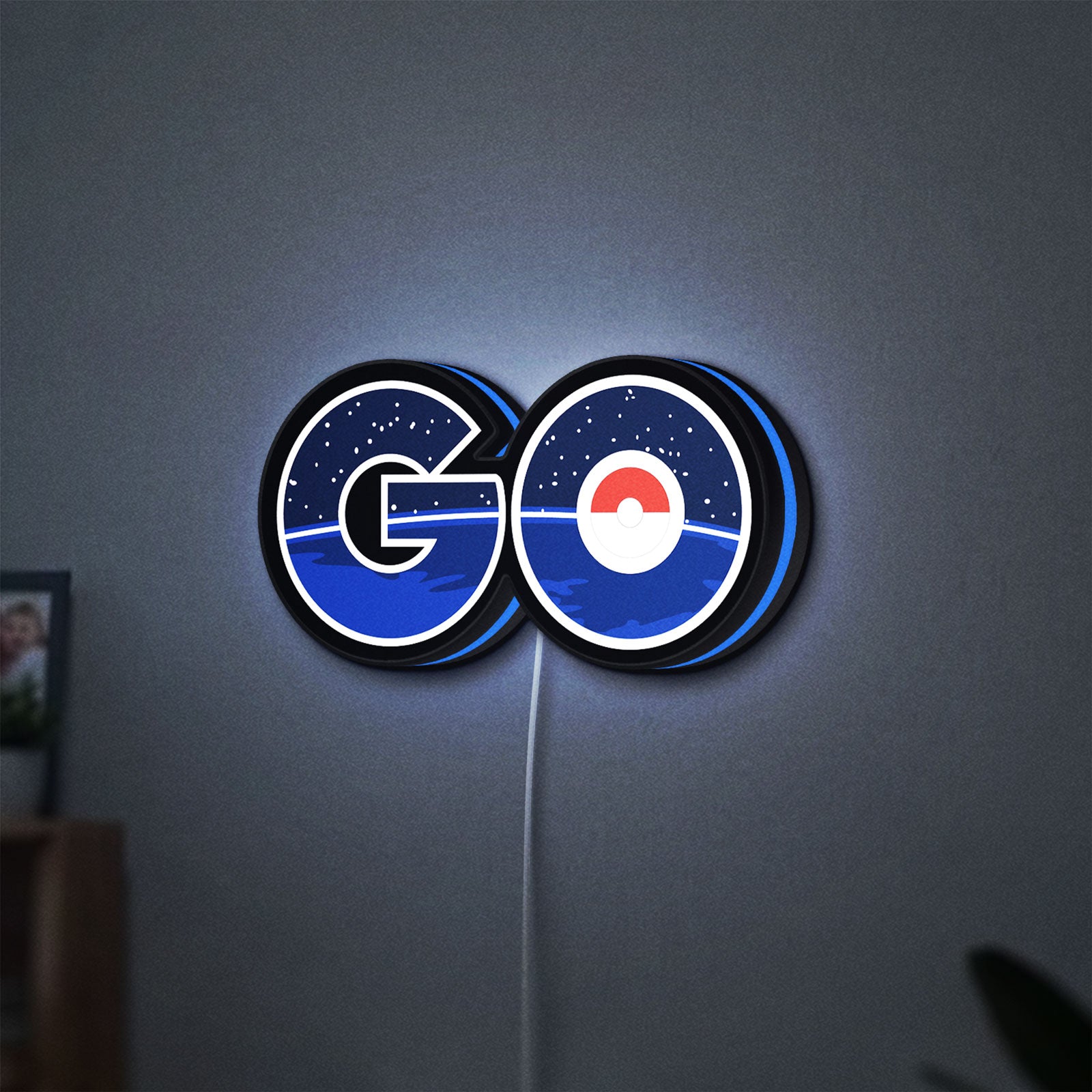 Pokemon Go LED lightbox hanging on a wall with blue glow