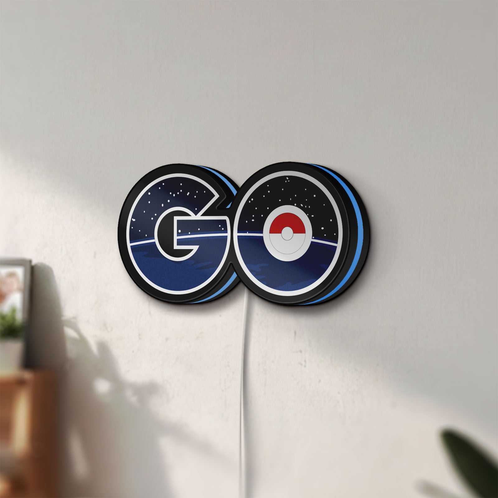Unlit Pokemon Go LED lightbox mounted on a wall in daylight