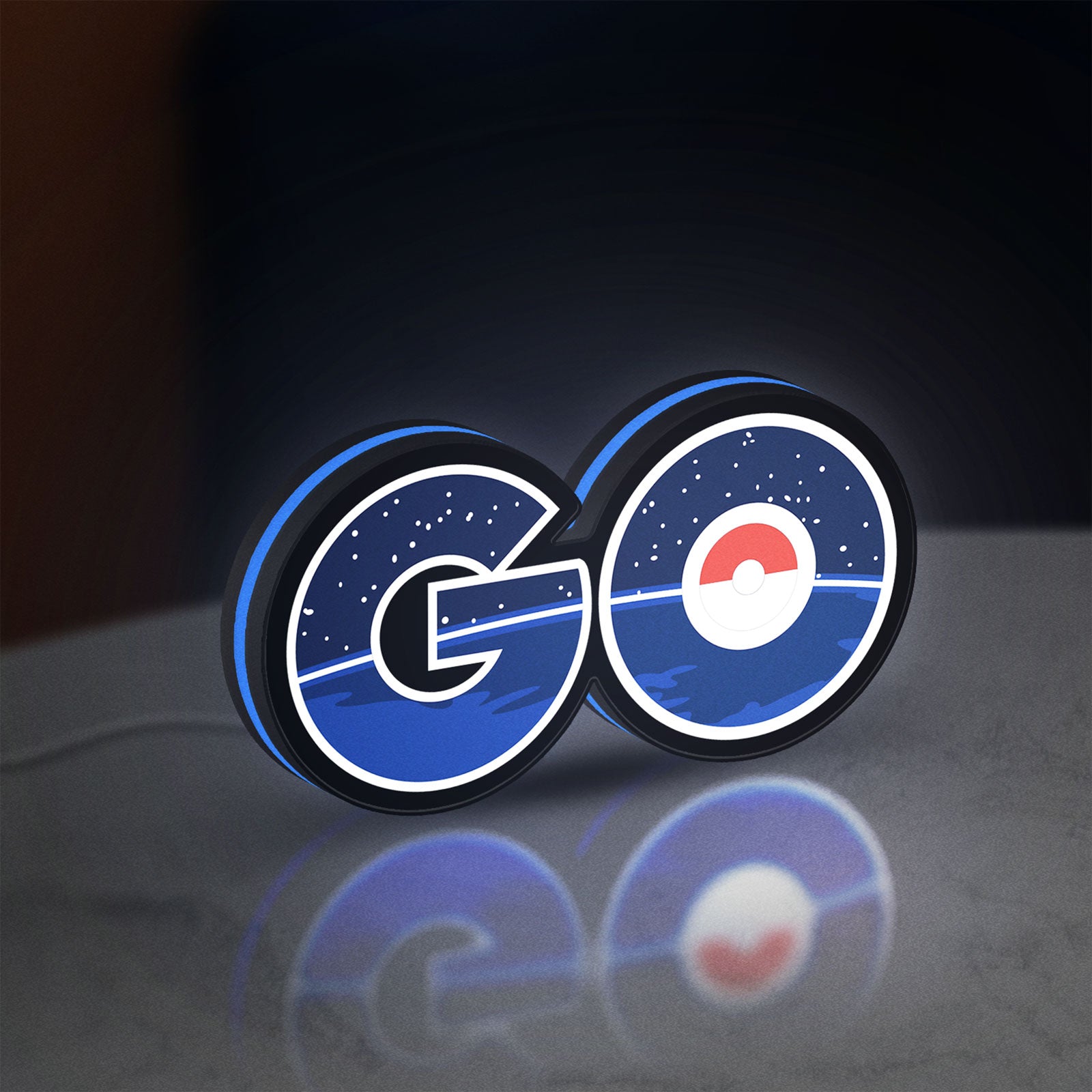 Pokemon Go LED lightbox standing on a desk from an angled side view with blue glow