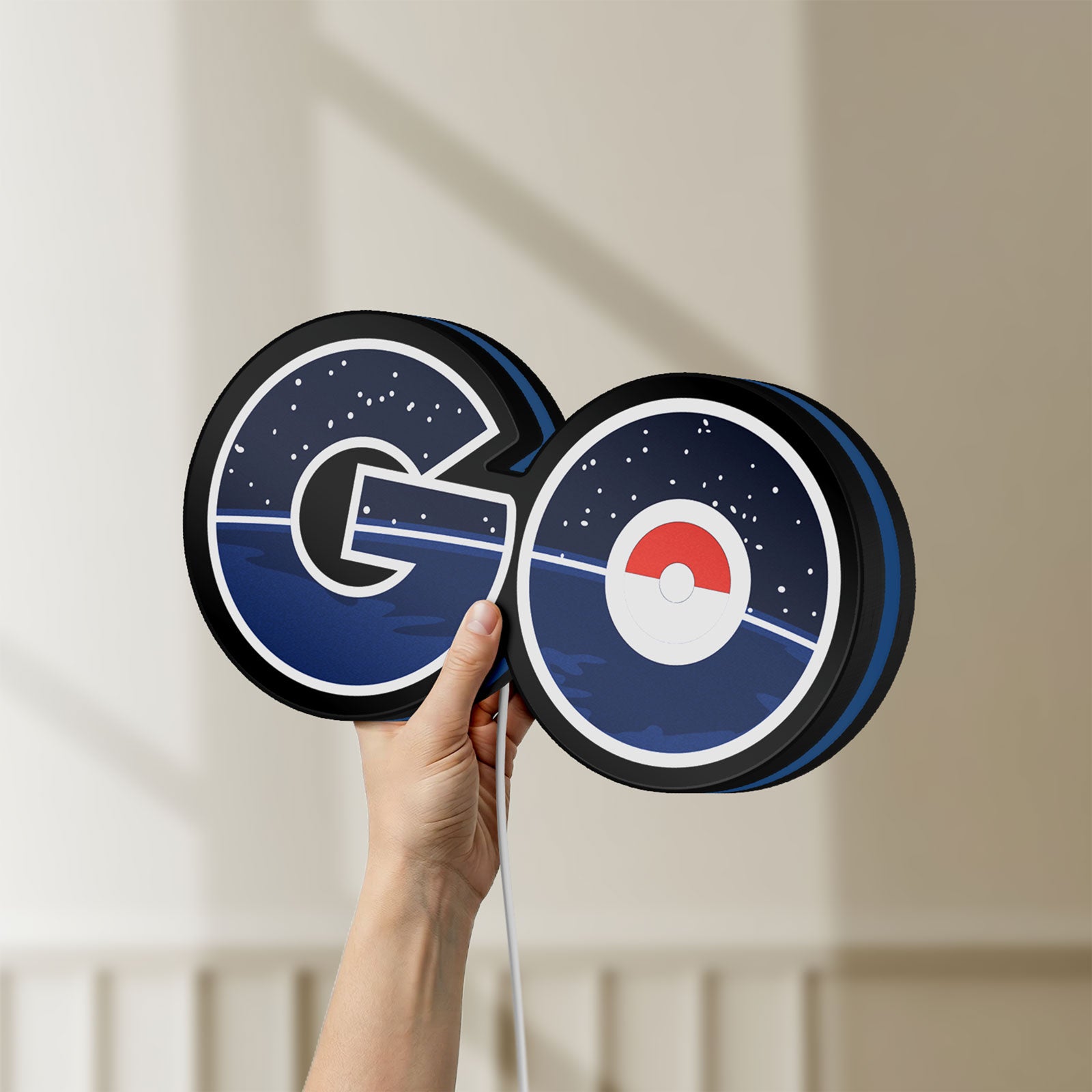 Unlit Pokemon Go LED lightbox held by hand to show size and details