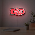 Dungeons Dragons 5e LED lightbox hanging on a room wall with soft red light