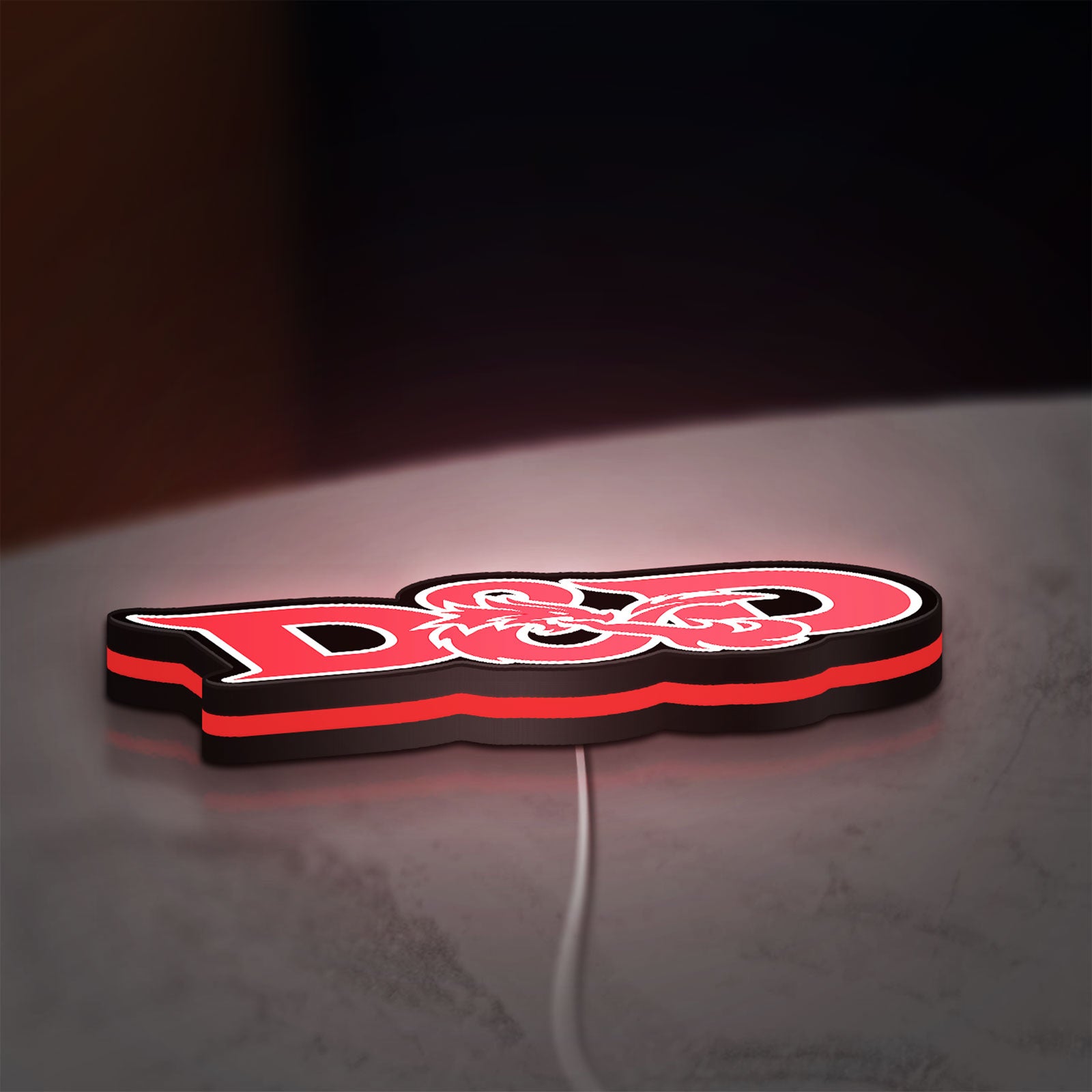 Dungeons Dragons 5e LED lightbox lying flat on a desk with red glow