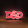 Front view of Dungeons Dragons 5e LED lightbox sign glowing on a wooden desk