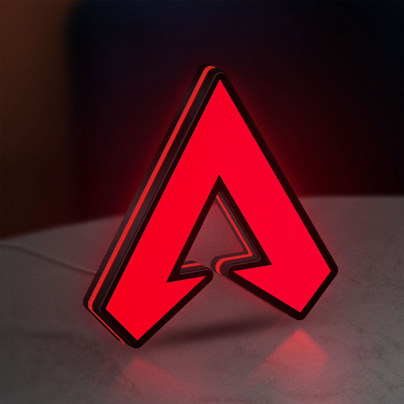 Apex LED lightbox standing on a desk from an angled side view with red glow