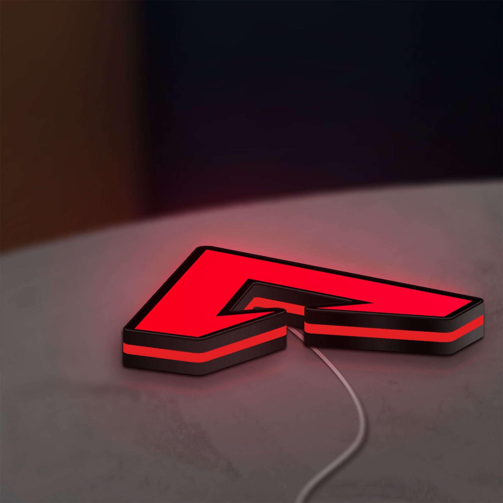 Apex LED lightbox lying flat on a desk with red glow