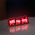 Toys For Tots Train LED lightbox standing on a desk from an angled side view with red glow