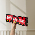 Unlit Toys For Tots Train LED lightbox held by hand to show size and details