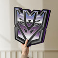 Unlit Decepticon LED lightbox held by hand to show size and details