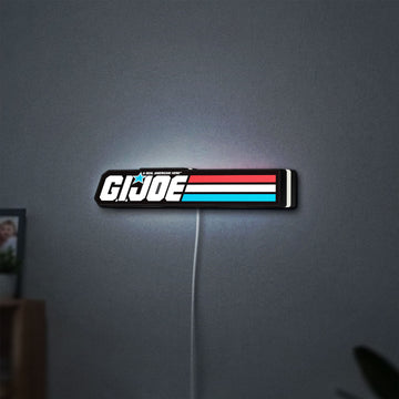 G.I. Joe LED lightbox hanging on a wall with white glow