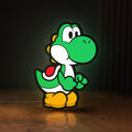 Front view of Yoshi LED lightbox sign glowing on a wooden desk