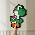 Unlit Yoshi LED lightbox held by hand to show size and details