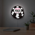 World Series of Poker LED lightbox hanging on a room wall with soft white light