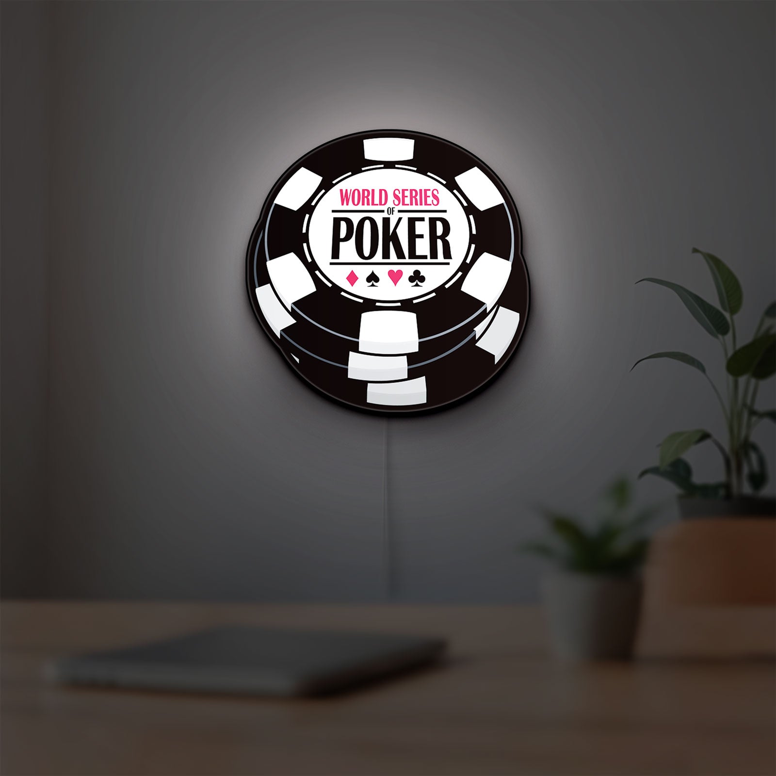 World Series of Poker LED lightbox hanging on a room wall with soft white light