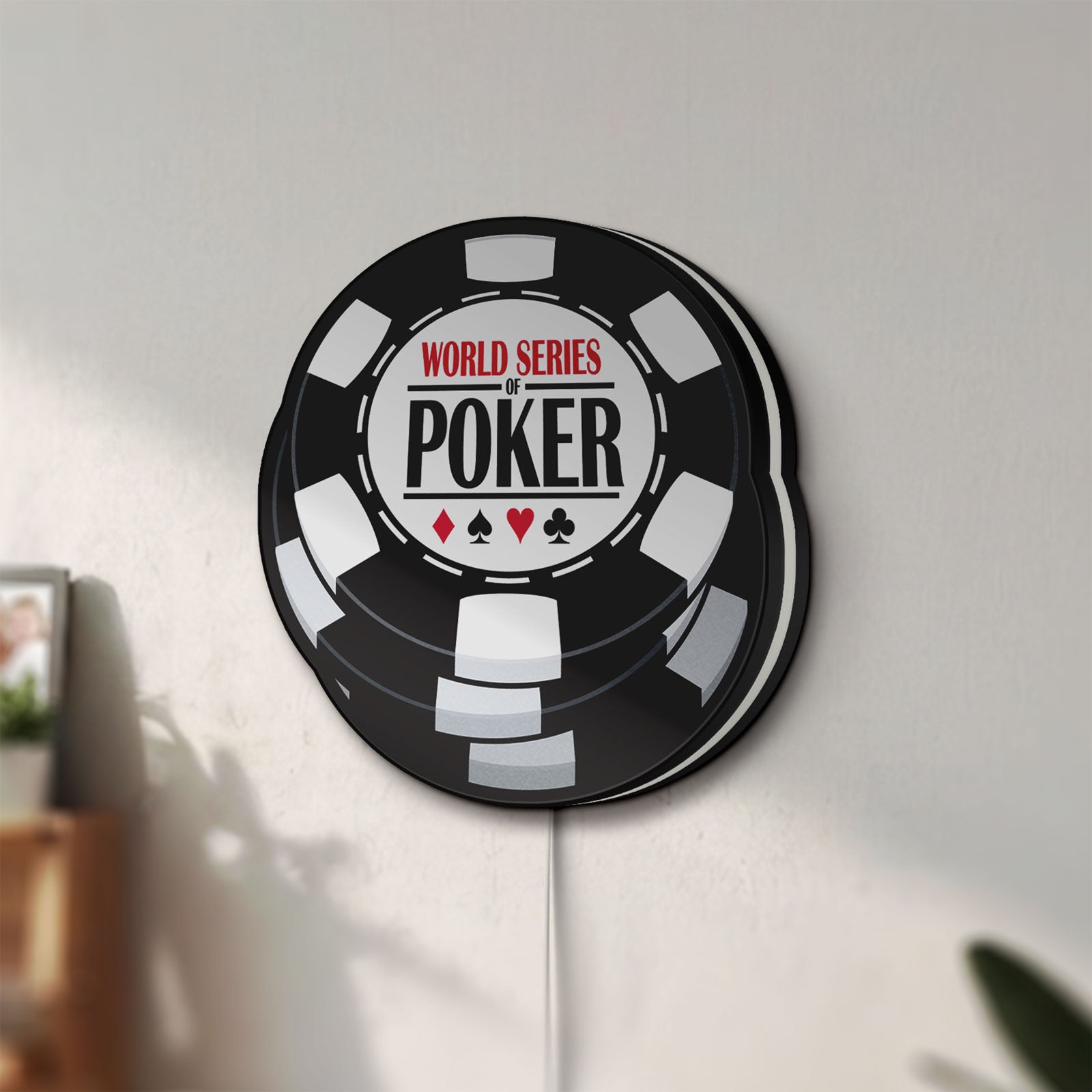 Unlit World Series of Poker LED lightbox mounted on a wall in daylight