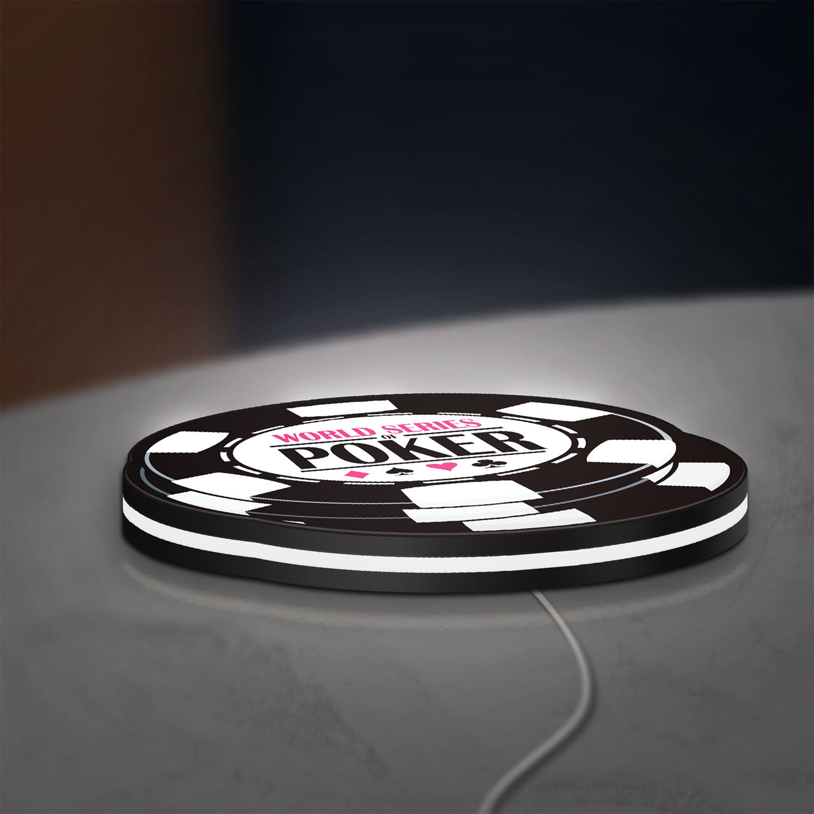 World Series of Poker LED lightbox lying flat on a desk with white glow