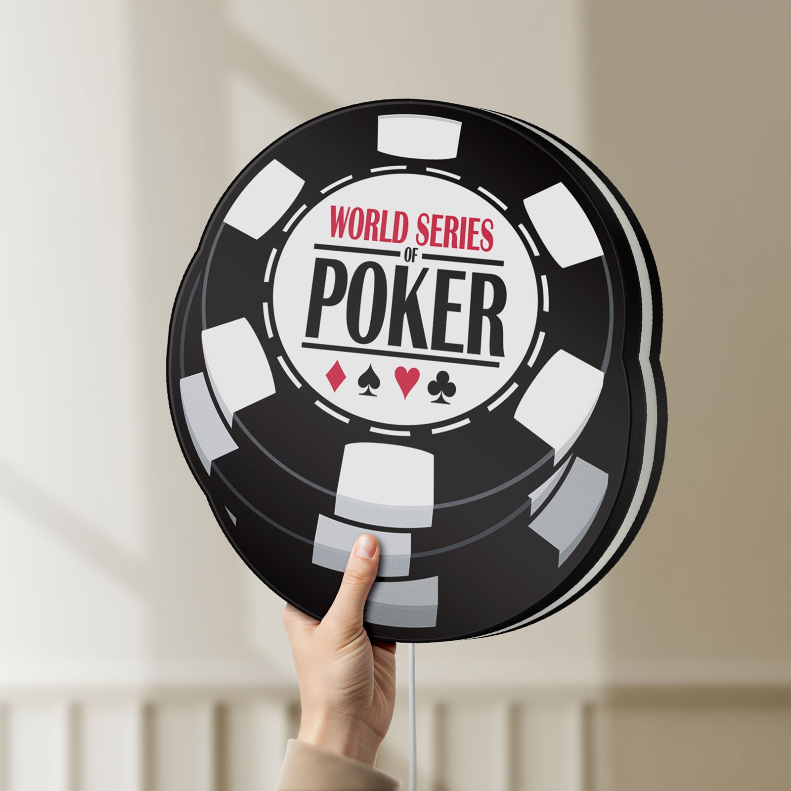 Unlit World Series of Poker LED lightbox held by hand to show size and details
