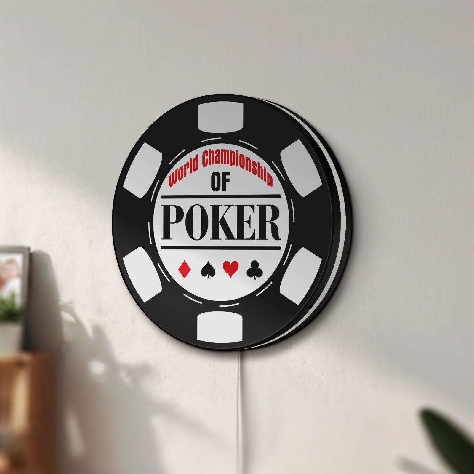 Unlit World Championship Poker LED lightbox mounted on a wall in daylight