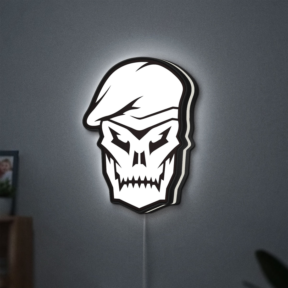 Call of Duty Black Ops Skull LED lightbox hanging on a wall with white glow