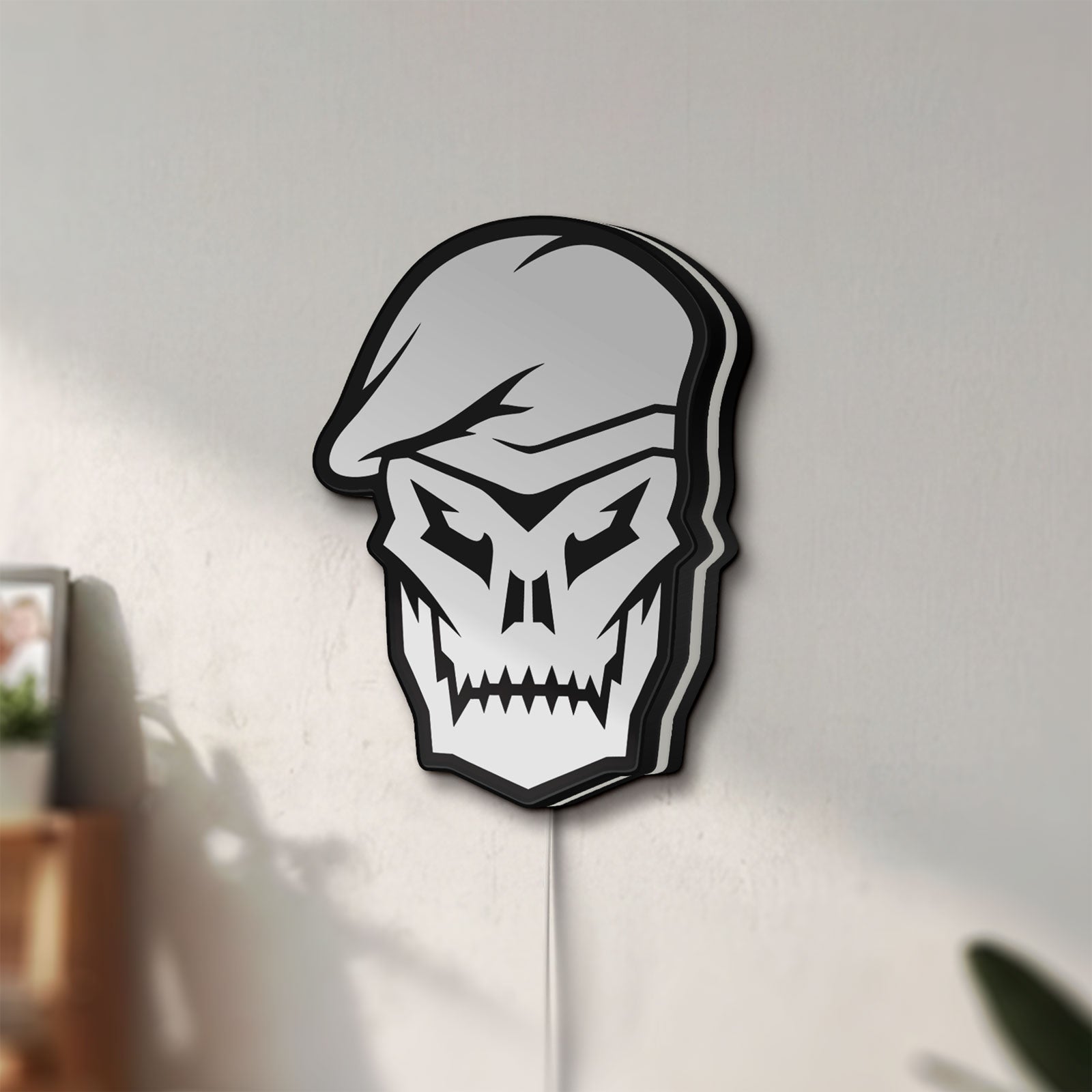 Unlit Call of Duty Black Ops Skull LED lightbox mounted on a wall in daylight