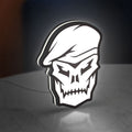 Call of Duty Black Ops Skull LED lightbox standing on a desk from an angled side view with white glow