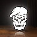 Front view of Call of Duty Black Ops Skull LED lightbox sign glowing on a wooden desk