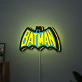 Batman LED lightbox hanging on a wall with yellow glow