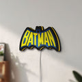 Unlit Batman LED lightbox mounted on a wall in daylight