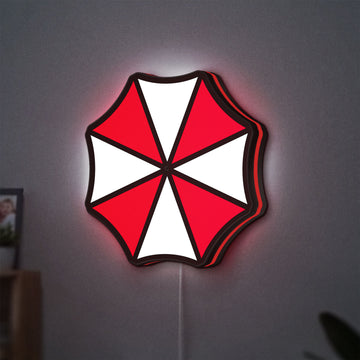 Umbrella Corps LED lightbox hanging on a wall with red glow