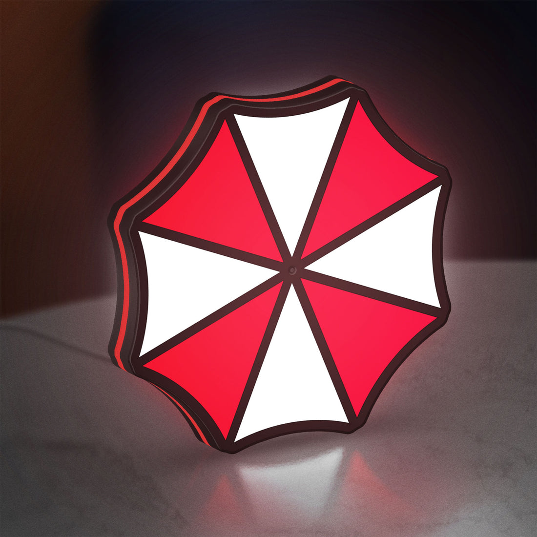Umbrella Corps LED lightbox hanging on a wall with red glow