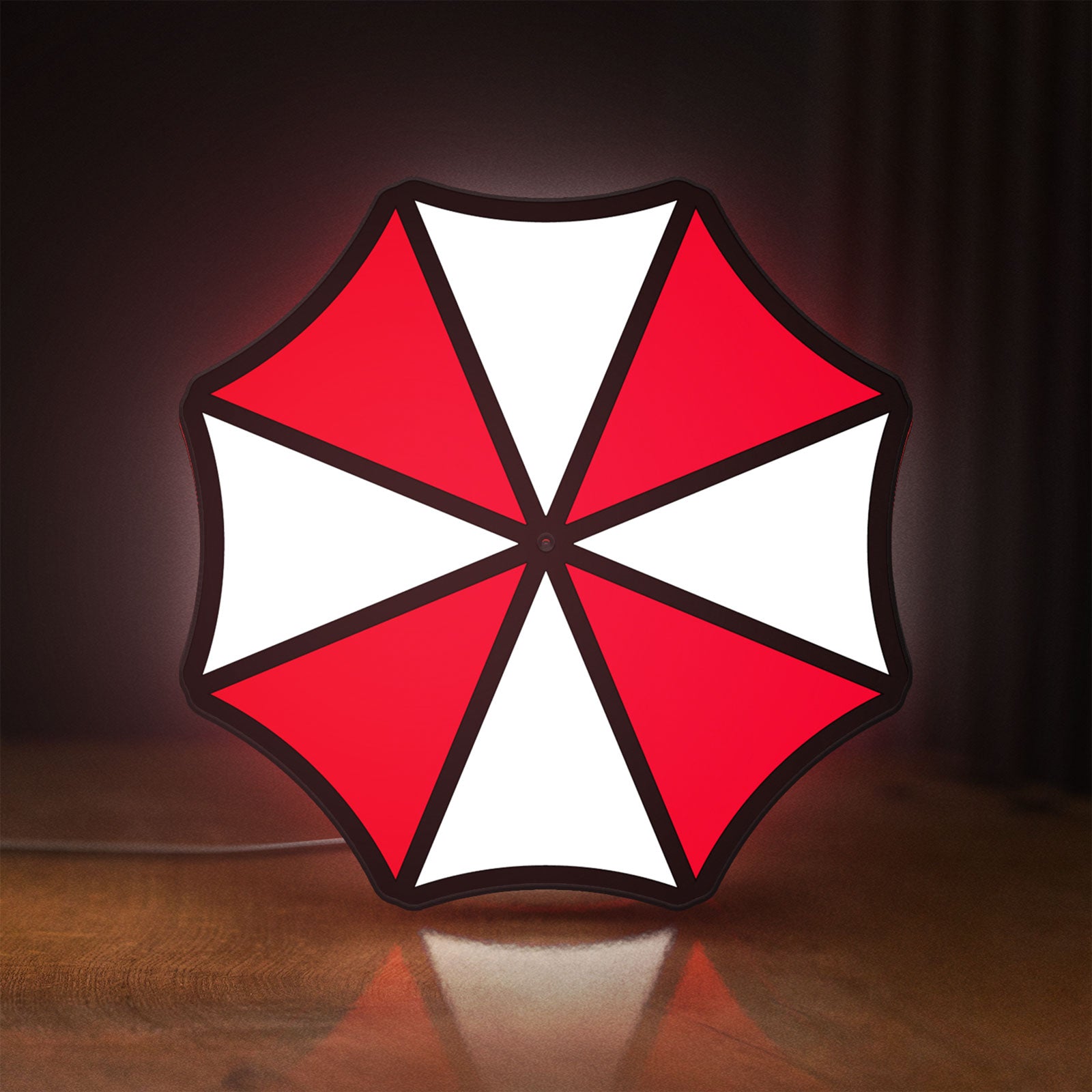 Front view of Umbrella Corps LED lightbox sign glowing on a wooden desk