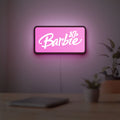 Barbie LED lightbox hanging on a room wall with soft pink light