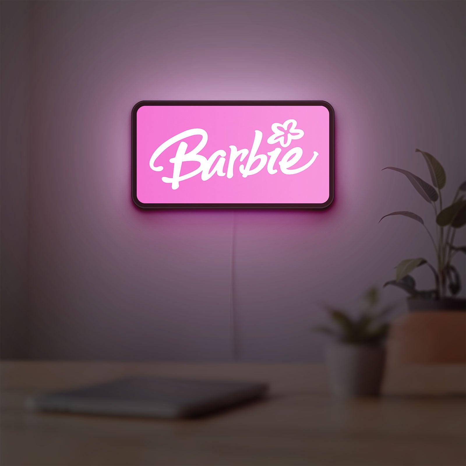 Barbie LED lightbox hanging on a room wall with soft pink light