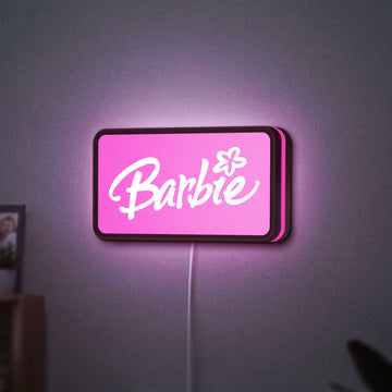 Barbie LED lightbox hanging on a wall with pink glow