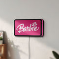 Unlit Barbie LED lightbox mounted on a wall in daylight