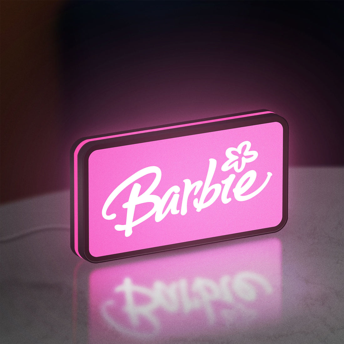 Barbie LED lightbox hanging on a wall with pink glow