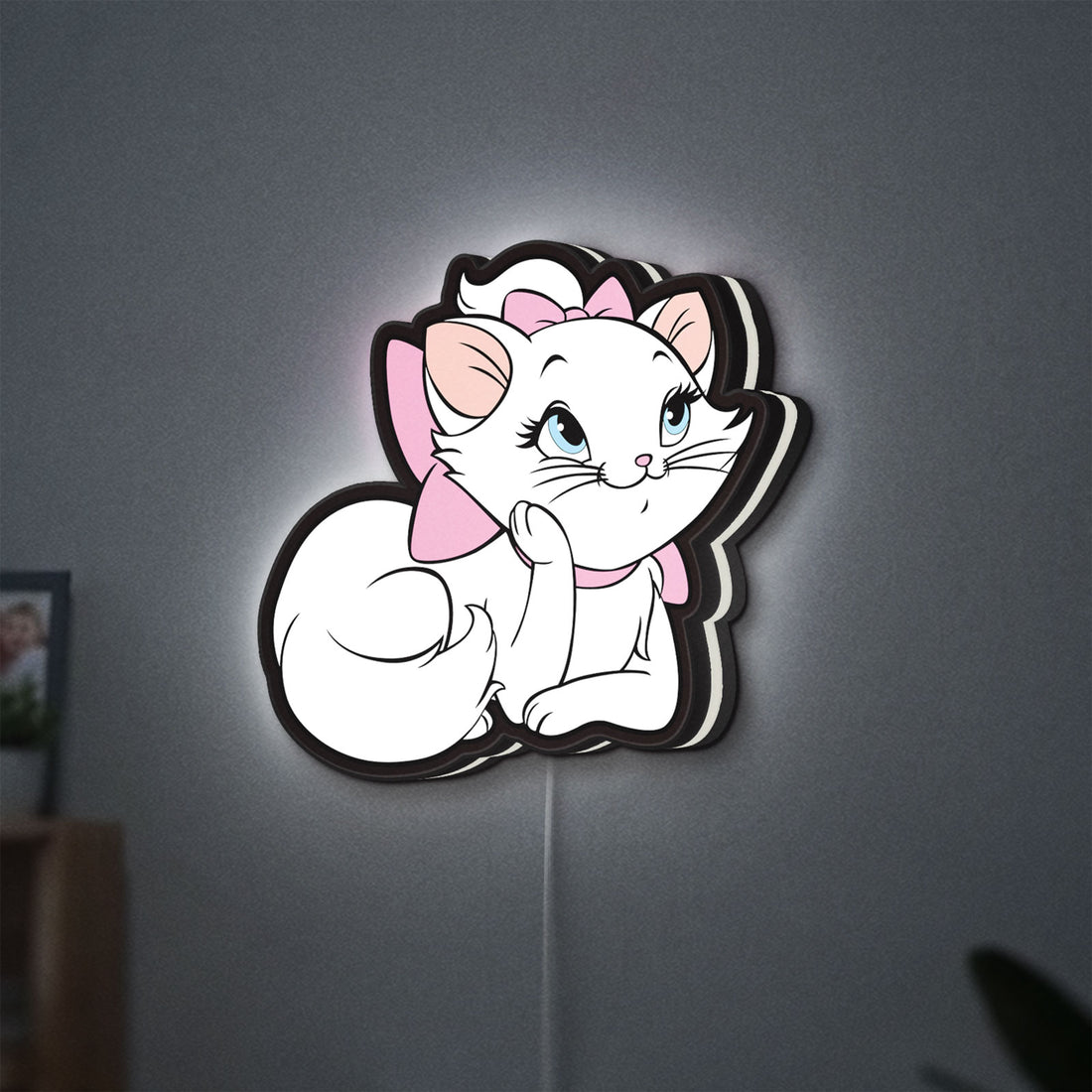 Marie Aristocats LED lightbox hanging on a wall with white glow