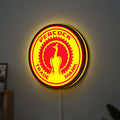 Standard Auto Parts LED lightbox hanging on a wall with yellow glow