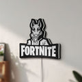 Unlit Fortnite LED lightbox mounted on a wall in daylight