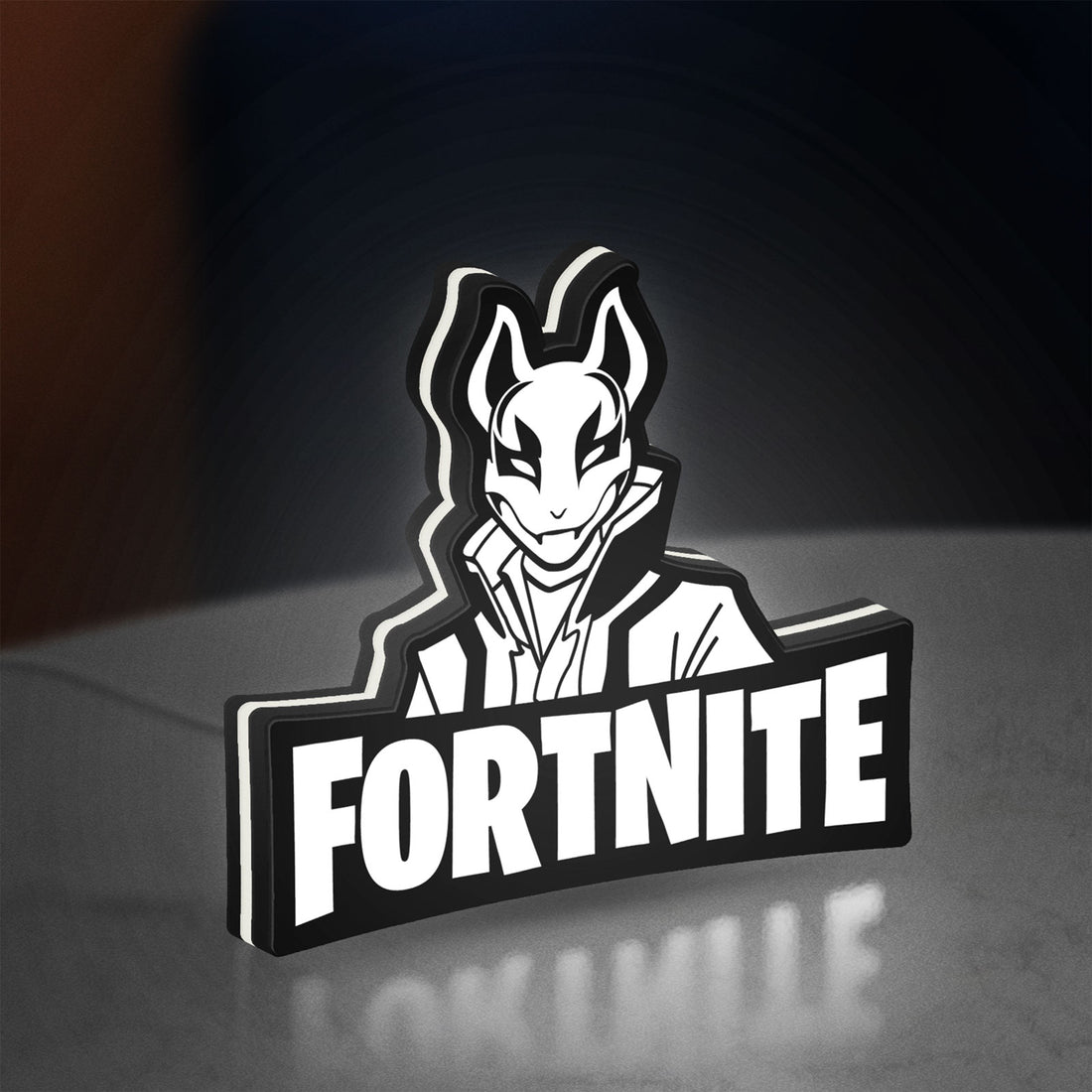 Fortnite LED lightbox hanging on a wall with white glow