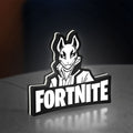 Fortnite LED lightbox standing on a desk from an angled side view with white glow
