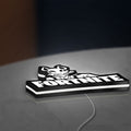 Fortnite LED lightbox lying flat on a desk with white glow