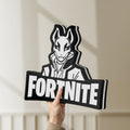 Unlit Fortnite LED lightbox held by hand to show size and details