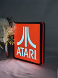 Atari LED Light Box (20cm) - Illuminated angled view standing, unique wall art for desk and room decor
