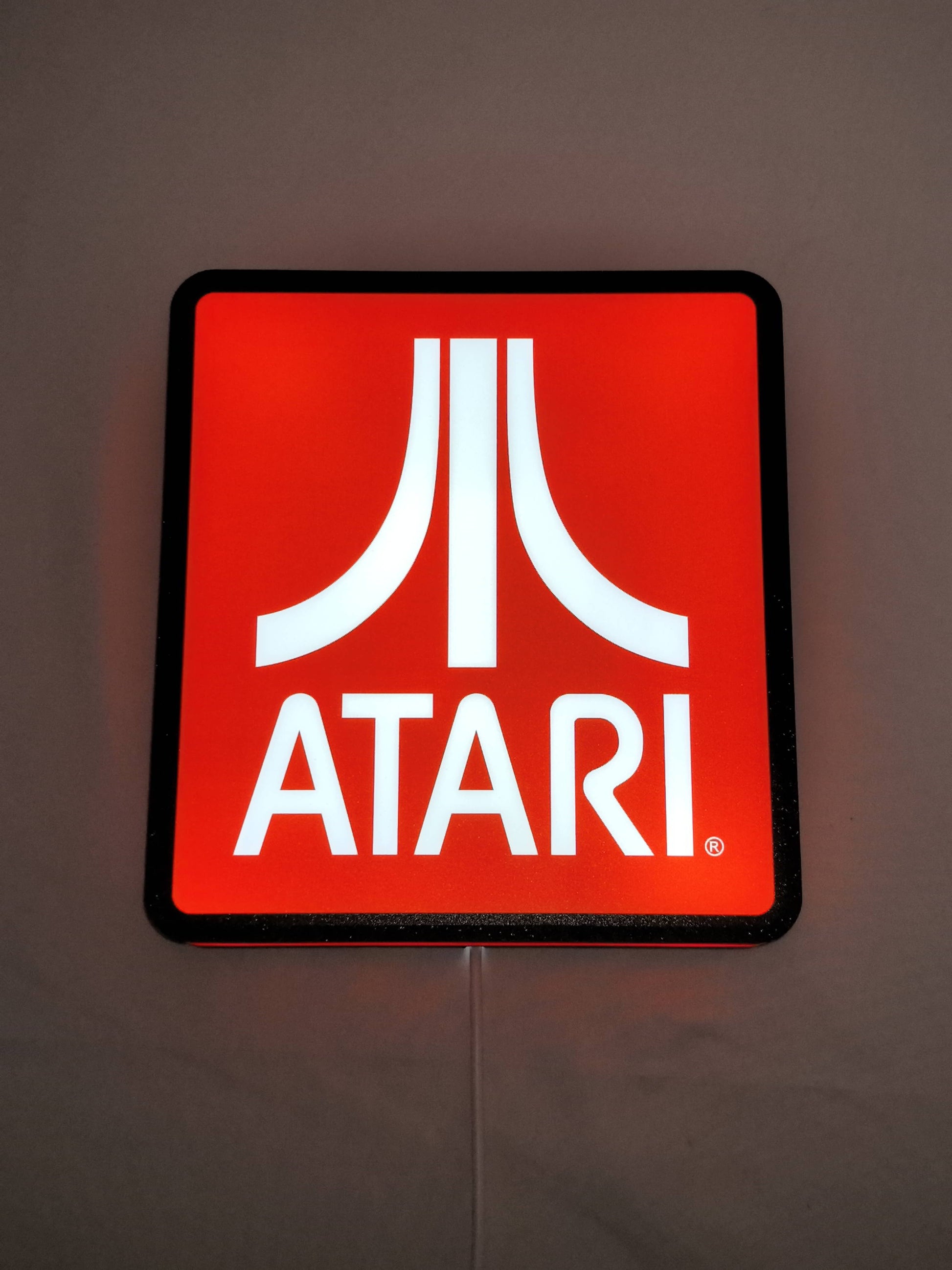 20cm Atari Glowing Wall Art - Illuminated flat lay front view, unique wall art for desk and room decor