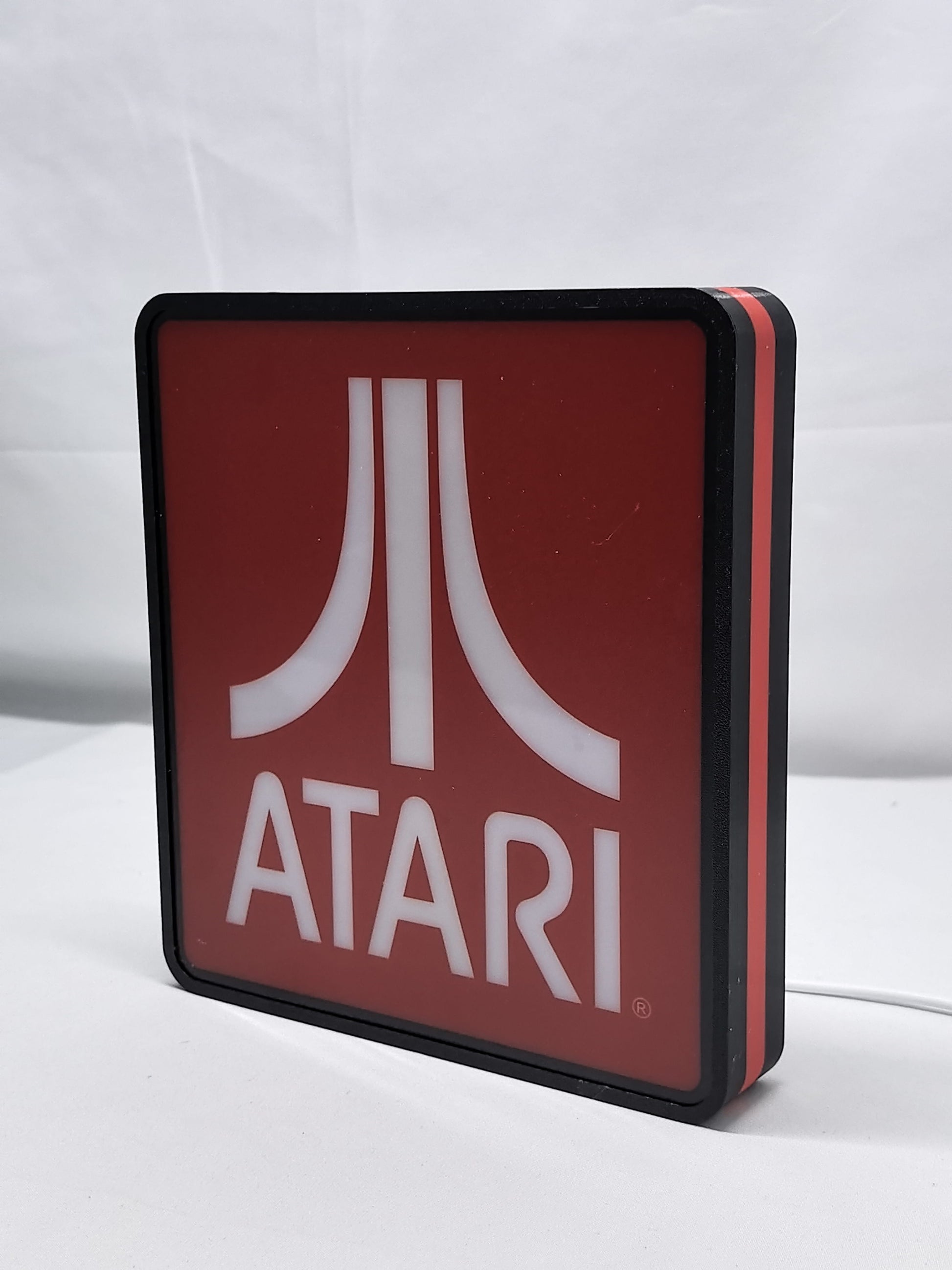 Unlit angled details standing of Atari Illuminated Sign in 20cm, unique wall art for desk and room decor