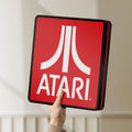 Unlit Atari LED lightbox held by hand to show size and details